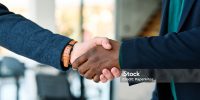 portrait of  a young businessman businessmen shaking hands introducing each other in the office